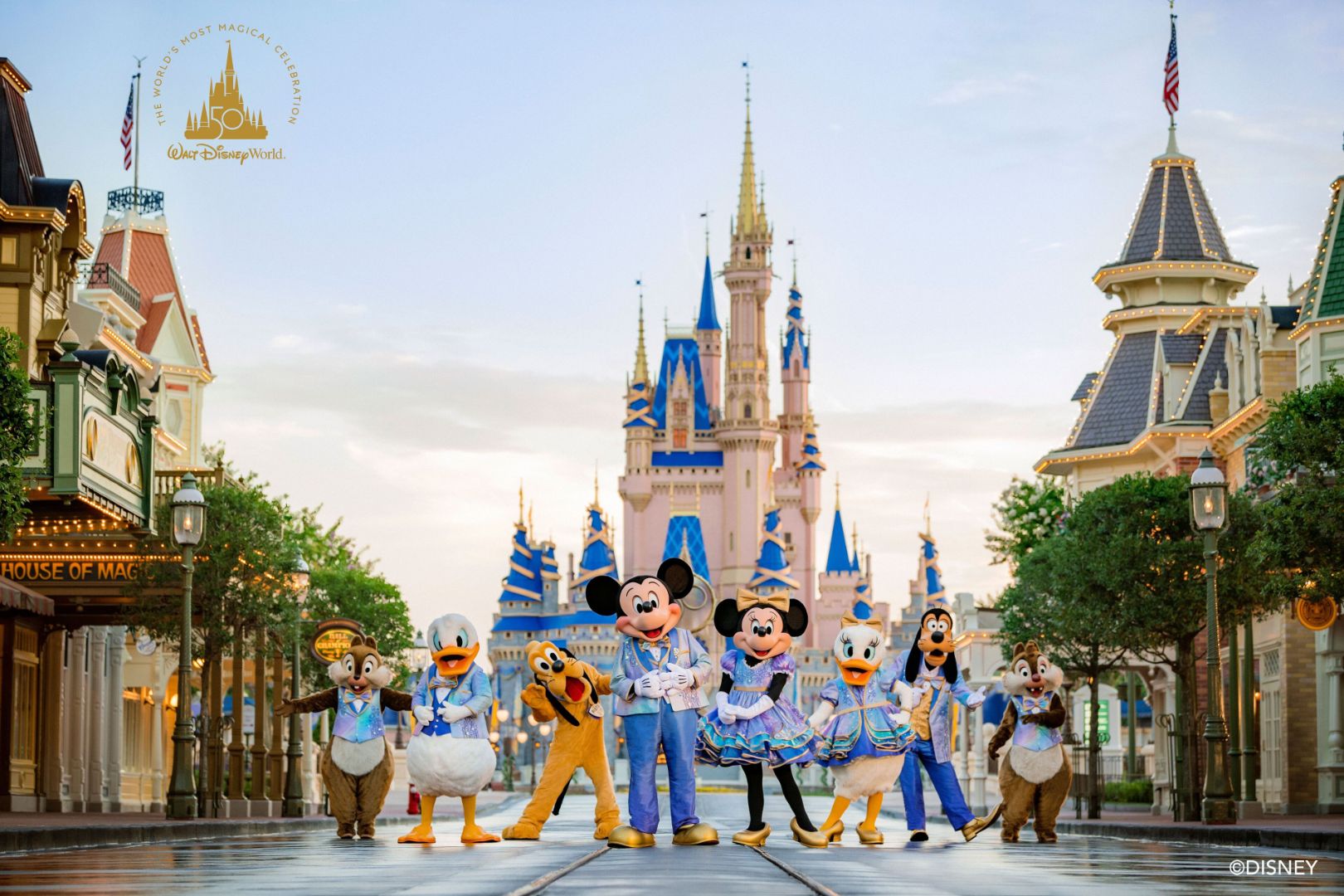 The ultimate guide to the Magic Kingdom Rides. An image of Mickey Mouse and his friends on Mainstreet USA in front of the castle.  